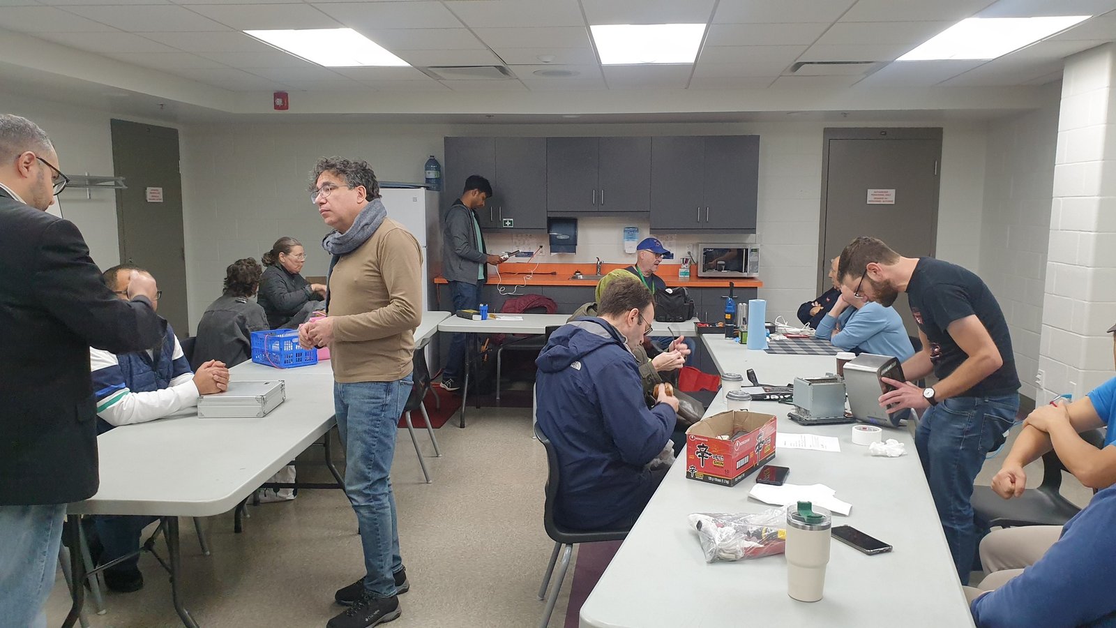 Community members working together to repair items at a Repair Cafe event